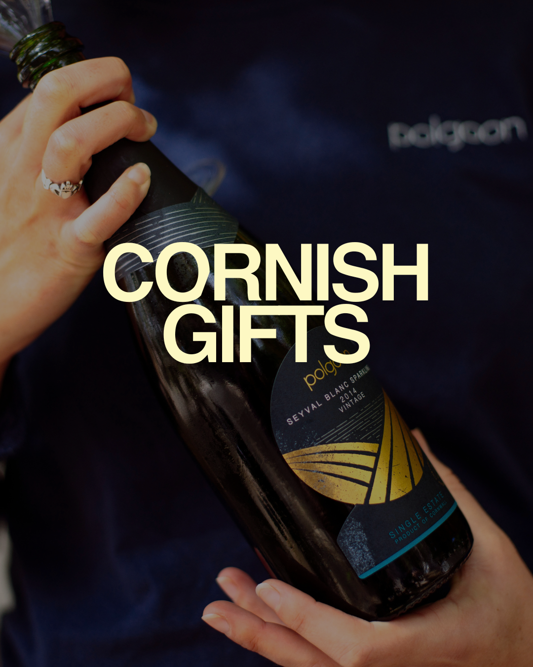 3 A bottle of Polgoon sparkling wine with large writing saying cornish gifts